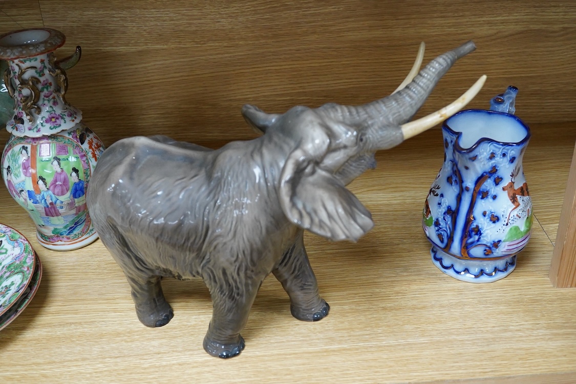A Beswick model of an elephant and a Staffordshire jug, c.1840, largest 34cm wide